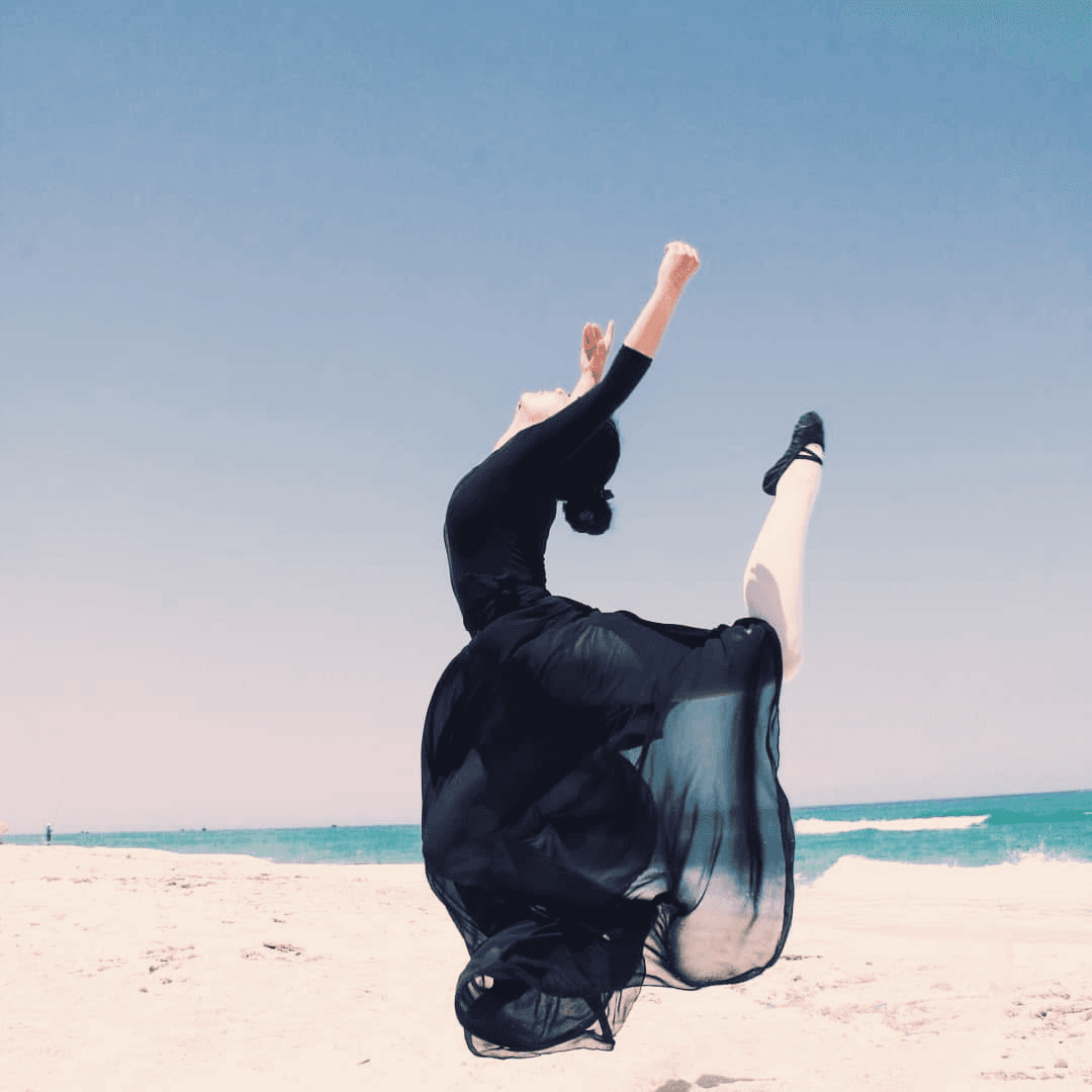 Ballerina performing by the sea